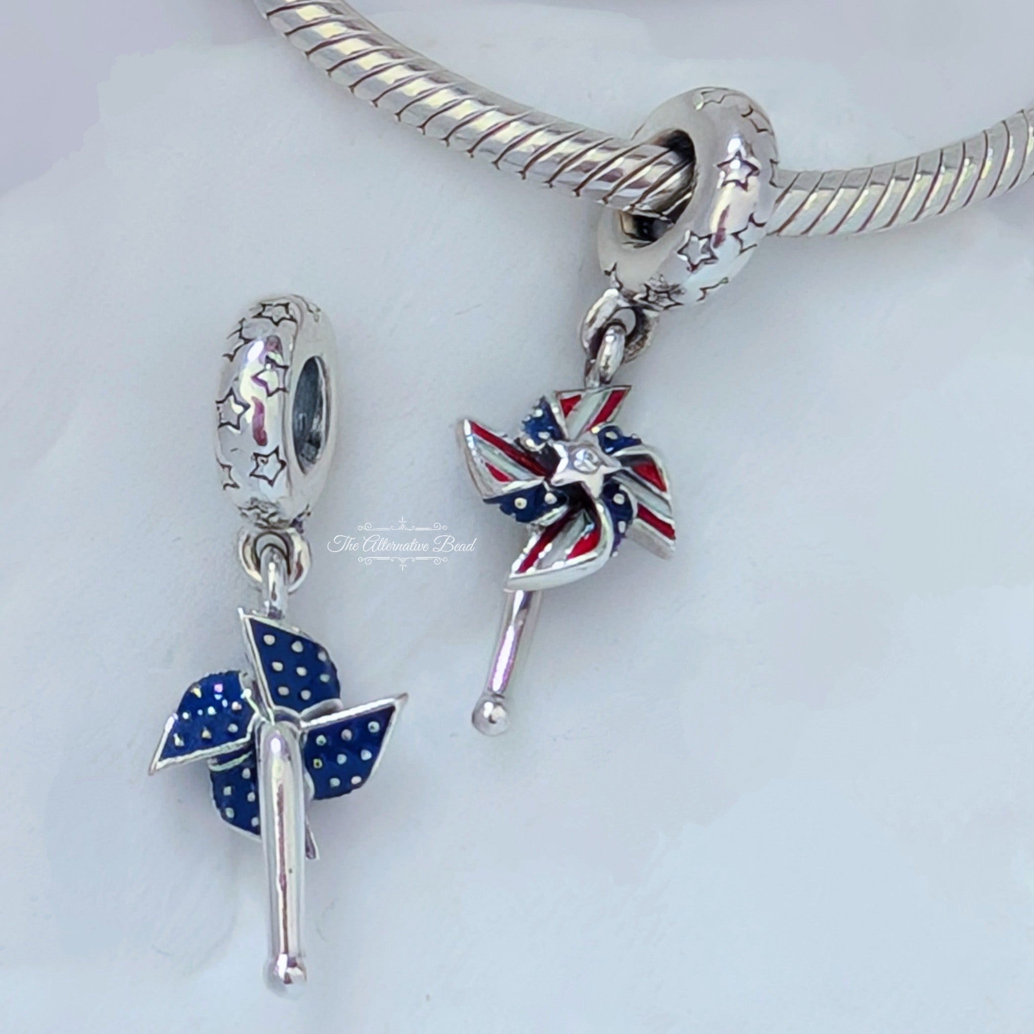Pandora American Pinwheel Dangle silver and red and blue sterling-silver and enamel Dangle by The Alternative Bead. Your Jewelry Retailer from Germany