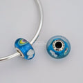 Pandora Iridescent Rainbow Murano Glass Charm (797013) rainbow and blue and white glass Bead by The Alternative Bead. Your Jewelry Retailer from Germany
