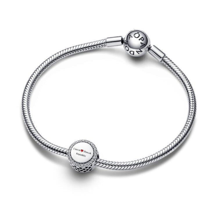 Silver bracelet with round charms on a white background