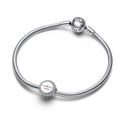 Silver bracelet with round charms on a white background