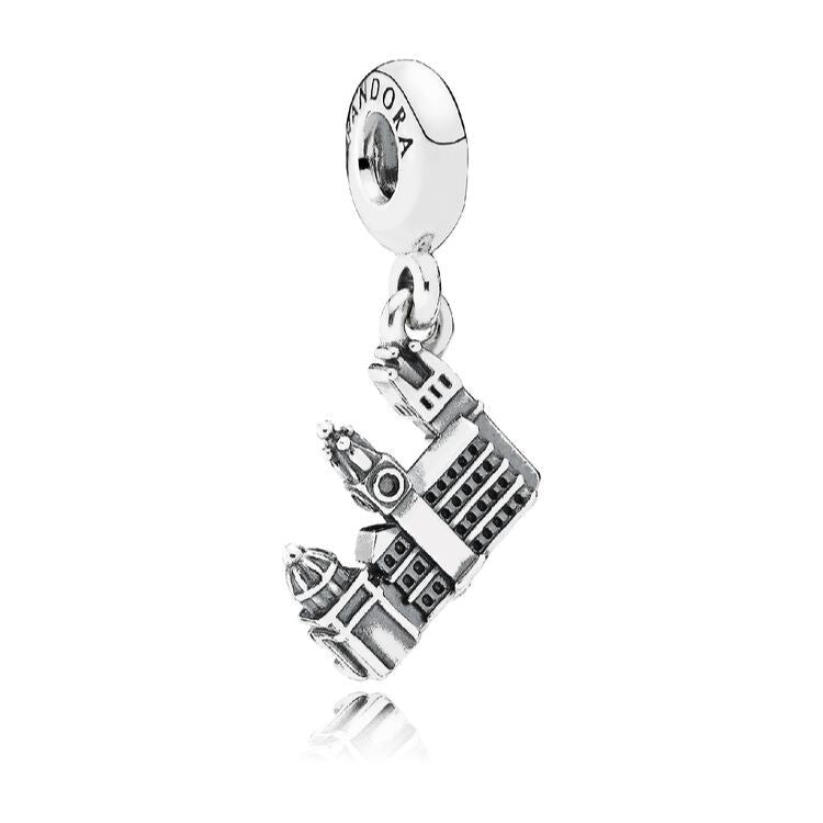 Silver charm with a detailed design on a white background