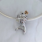 Pandora Fairytale fish silver charm with 14k, orange and golden coloured cubic zirconia and black crystal silver and gold sterling-silver and gold and crystal Bead by The Alternative Bead. Your Jewelry Retailer from Germany