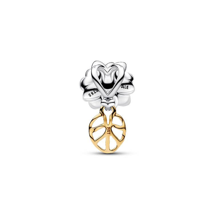 Silver and gold charm with heart and peace symbol on a white background