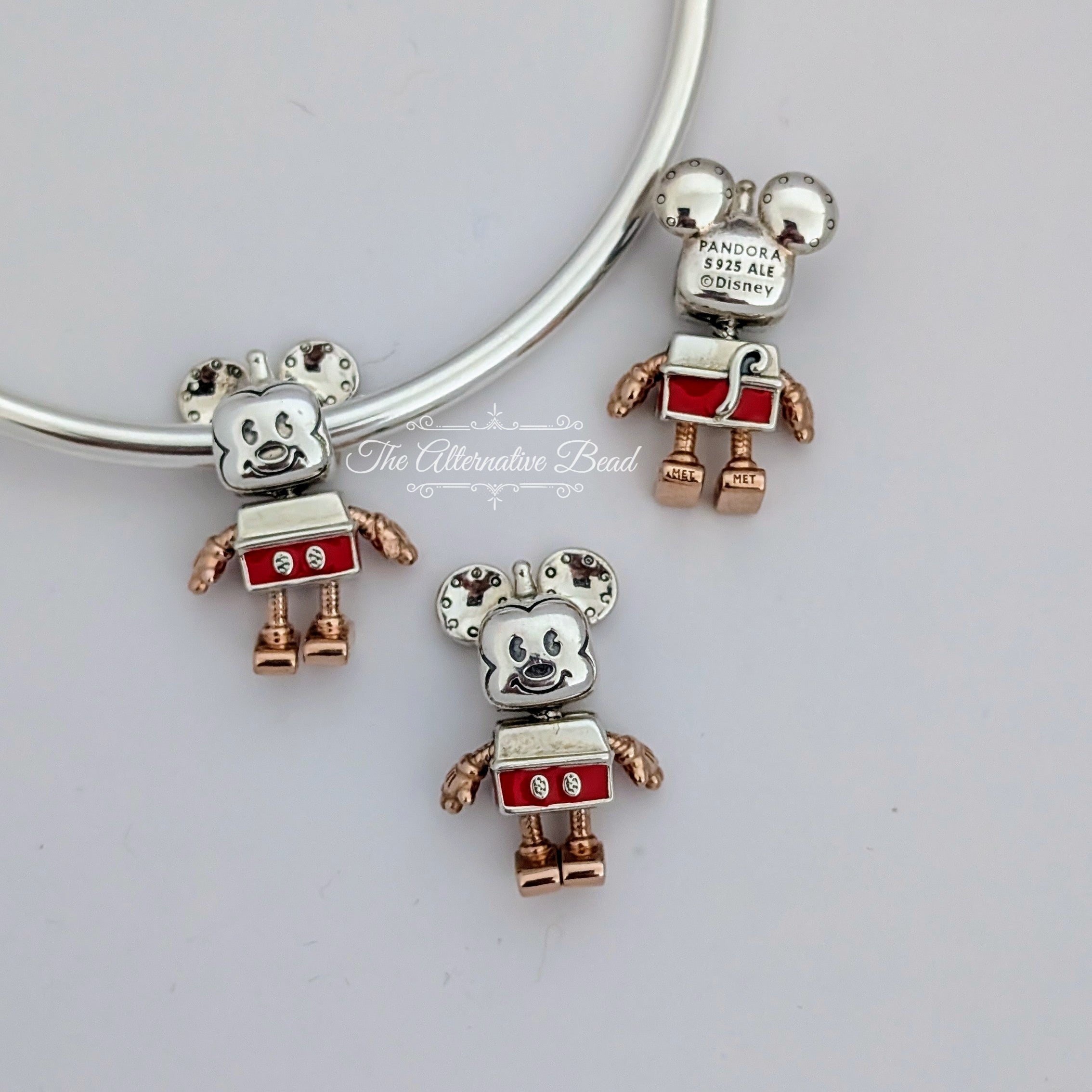Disney x Pandora Mickey Mouse Robot Charm (789073C01) silver and rose-gold and red sterling-silver and rose-gold and enamel Bead by The Alternative Bead. Your Jewelry Retailer from Germany