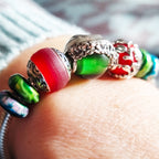 Aurora Charm Santas Hat Glass Bead silver; green sterling-silver; enamel; glass Bead by The Alternative Bead. Your official Aurora Charm Retailer from Germany