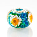 VIP-CHARMS Daffodil Paradise Bead blue; green; white; orange glass Bead by The Alternative Bead. Your official VIP-CHARMS Retailer from Germany