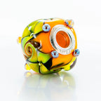VIP-CHARMS Golden Whimsy Bead orange; green glass Bead by The Alternative Bead. Your official VIP-CHARMS Retailer from Germany