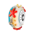 Elfbeads Starfish Shore Starlight blue; white; glow-in-the-dark; red glass Bead by The Alternative Bead. Your official Elfbeads Retailer from Germany