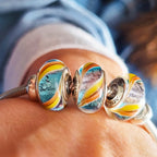 Aurora Charm Sweet Candy Murano Glass Bead Charm blue; yellow; orange glass Bead by The Alternative Bead. Your official Aurora Charm Retailer from Germany