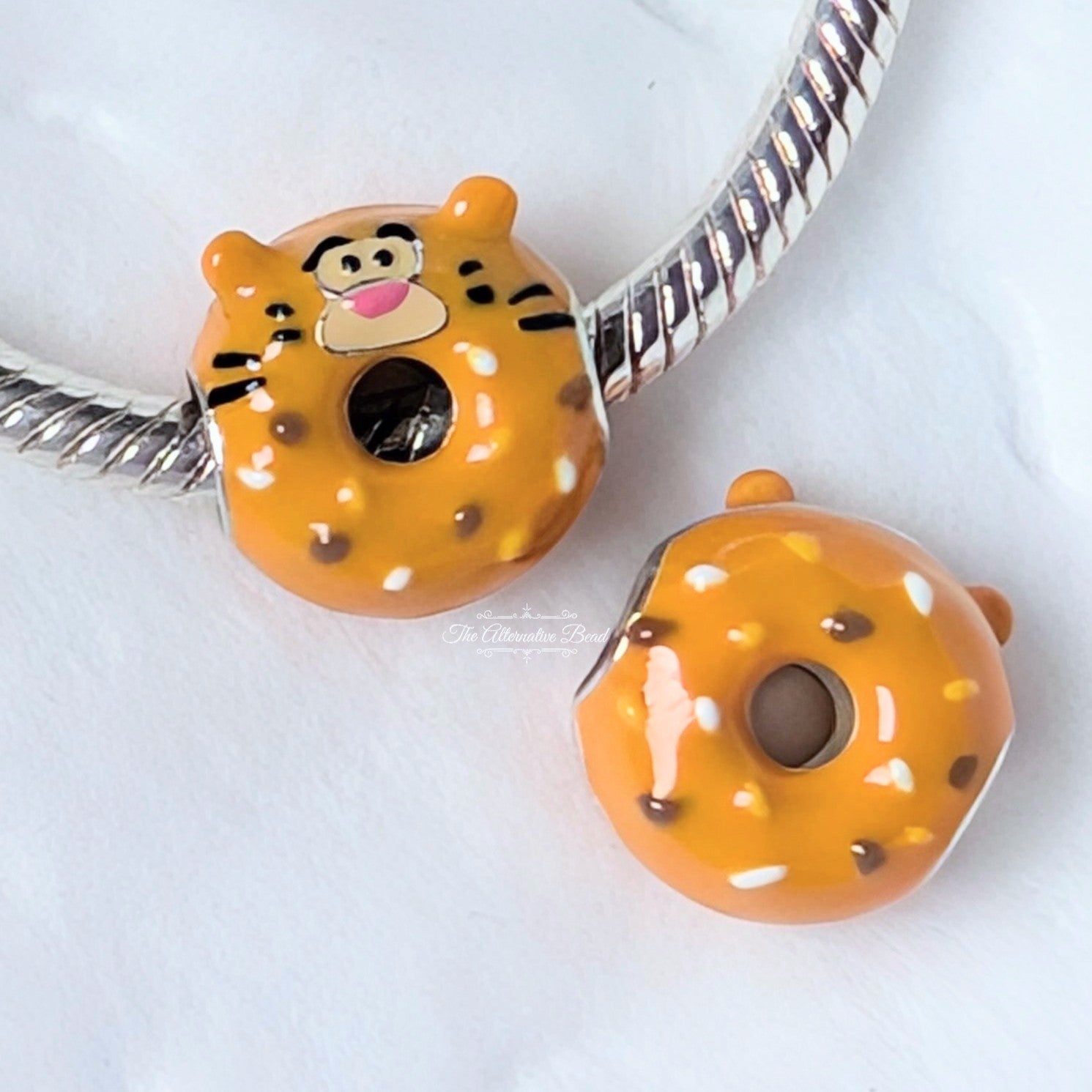 Beadscollection Tigger Donut silver; black; orange; brown sterling-silver; enamel Bead by The Alternative Bead. Your Jewelry Retailer from Germany