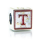 Cube-shaped charm with letter 'T' on a white background