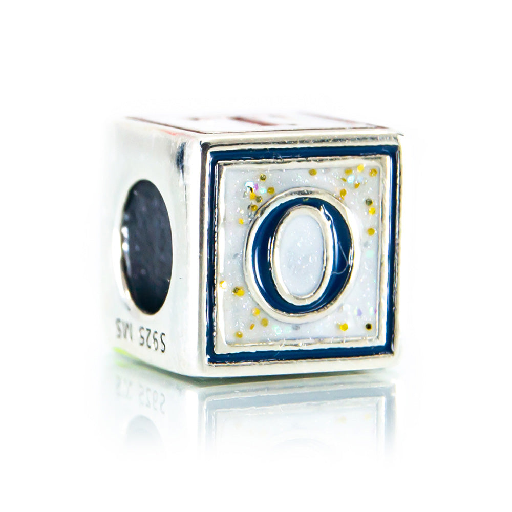 Silver charm with letter 'O' on a white background