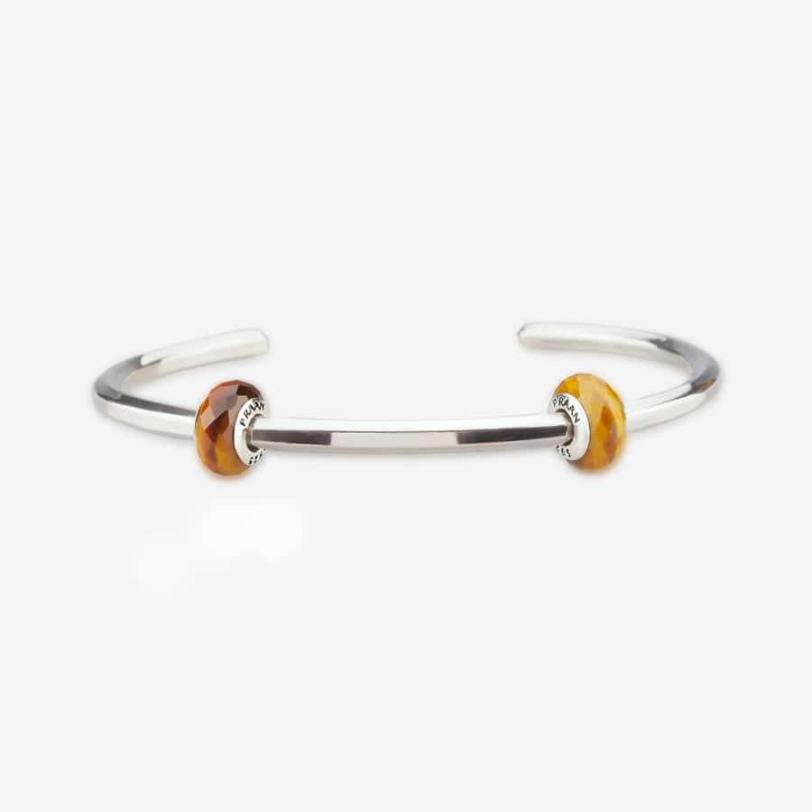 Praan Tiger Eye Stopper Charms brown and bronze and orange natural-stone Stopper by The Alternative Bead. Your official Praan Retailer from Germany