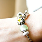 Aurora Charm Frangipani Yellow White Flower Charm silver; yellow; white sterling-silver; enamel Bead by The Alternative Bead. Your official Aurora Charm Retailer from Germany