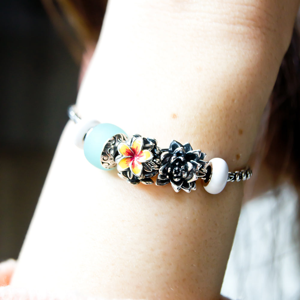 Aurora Charm Frangipani Red Yellow Flower Charm silver; red; yellow sterling-silver; enamel Bead by The Alternative Bead. Your official Aurora Charm Retailer from Germany