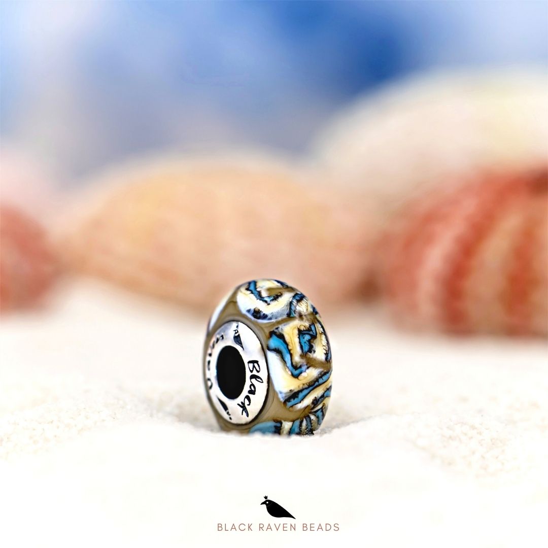 Black Raven Beads Sea Tides brown and white and blue glass Charm by The Alternative Bead. Your official Black Raven Beads Retailer from Germany