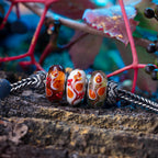Elfbeads Leaflight Poem green; orange; gold glass Bead by The Alternative Bead. Your official Elfbeads Retailer from Germany