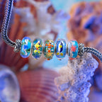 Elfbeads Reeflight Garden blue; red glass Bead by The Alternative Bead. Your official Elfbeads Retailer from Germany