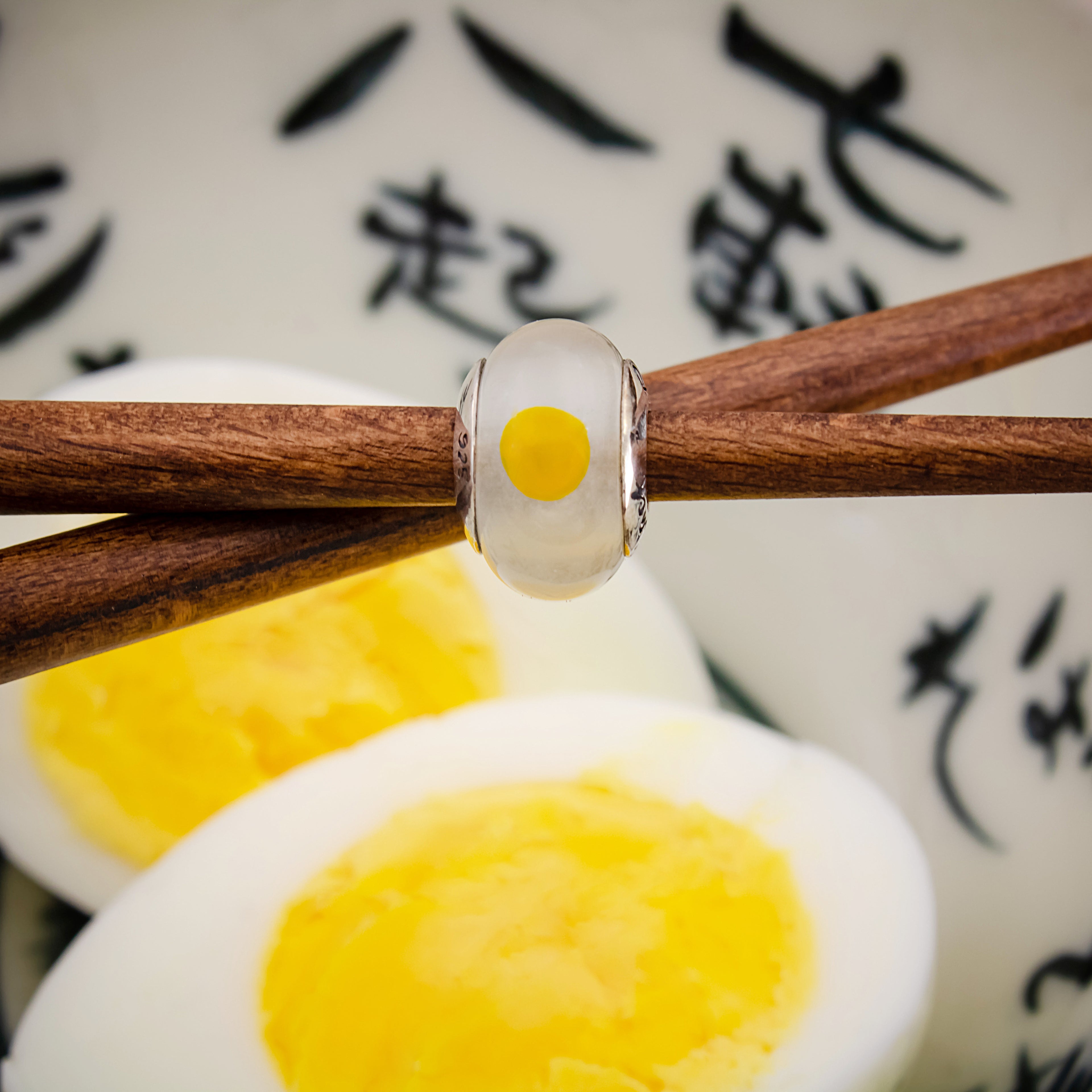 Black Raven Beads Egg white and yellow glass Charm by The Alternative Bead. Your official Black Raven Beads Retailer from Germany