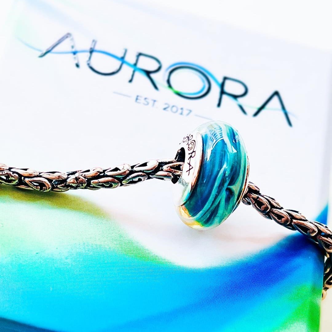 Aurora Charm Duel of Destiny Glass Bead blue; multicolor glass Bead by The Alternative Bead. Your official Aurora Charm Retailer from Germany