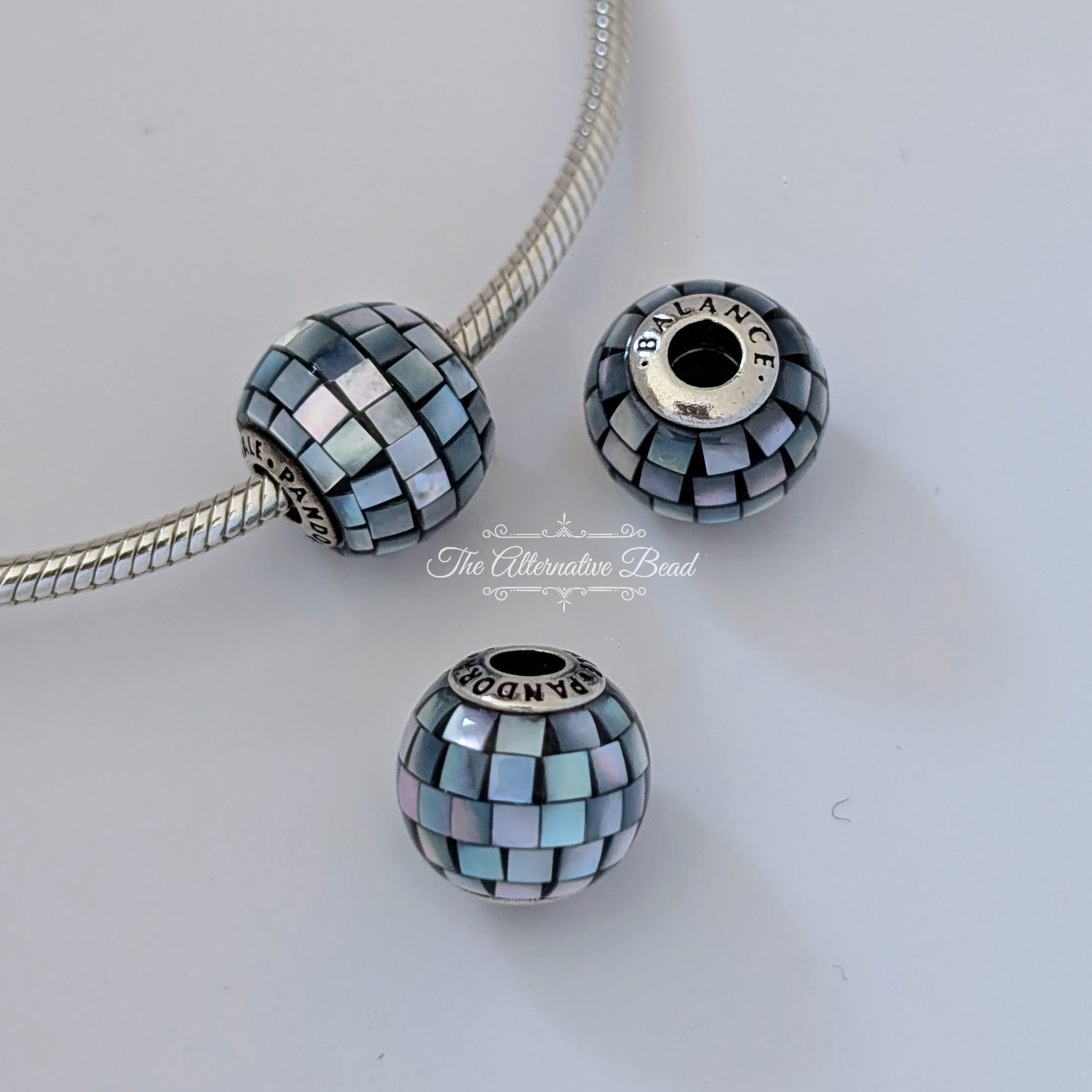 Pandora Sterling Silver Essence Balance Charm with Blue-Grey Mother of Pearl Mosaic (796080MMB) blue sterling-silver and mother-of-pearl Bead by The Alternative Bead. Your Jewelry Retailer from Germany